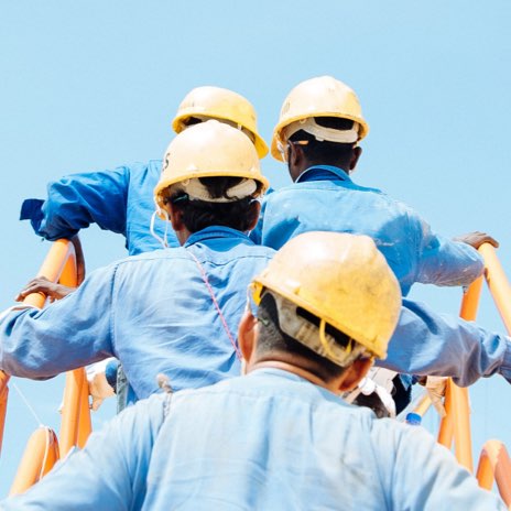 Workers climbing stairs