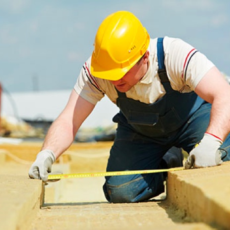 worker using measuring tape